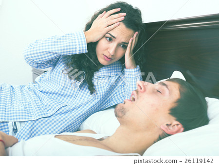 Angry girl tired of loud boyfriend snore Angry girl tired of loud boyfriend snore 26119142