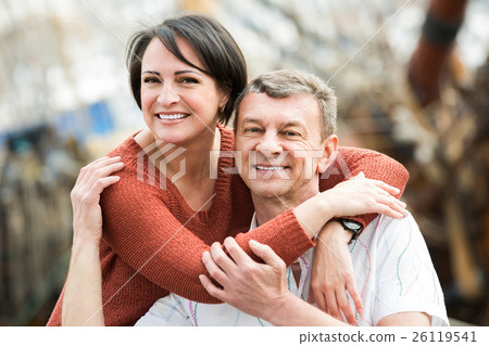 couple hugging outdoors at spring day couple hugging outdoors at spring day 26119541