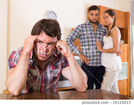 Three unhappy adults having troubles 26120015