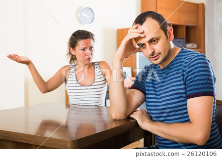 family couple shouting while arguing indoors family couple shouting while arguing indoors 26120106