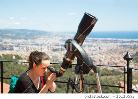 woman looking in telescope woman looking in telescope 26120552