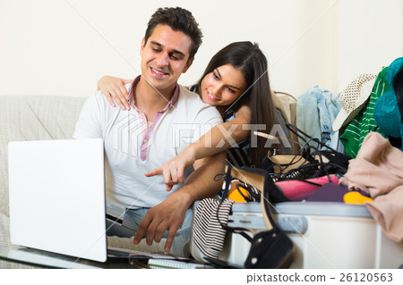 Couple with notebook and credit card. Couple with notebook and credit card. 26120563