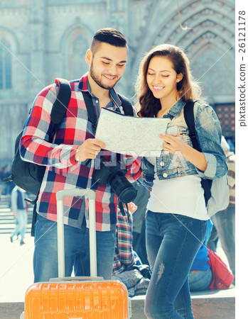 Couple with luggage walking 26121178