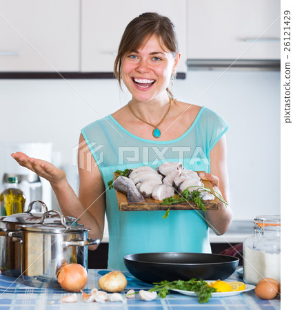housewife frying saltwater fish 26121429