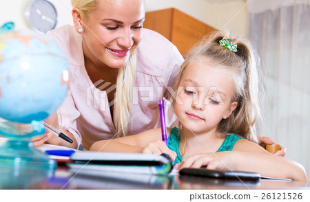 Happy mother helping little daughter 26121526