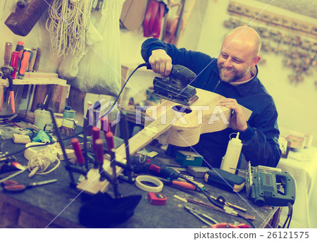 Atelier posing with his guitars 26121575