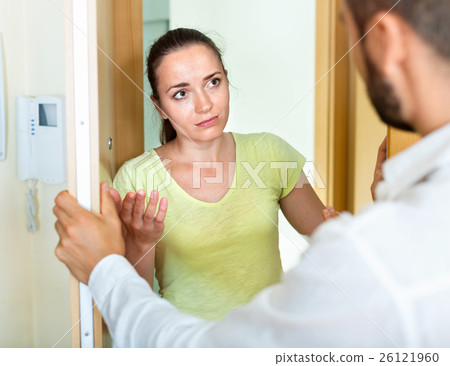 Young irritated couple quarreling 26121960