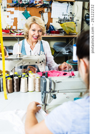 Tailor using sewing machine 26122232