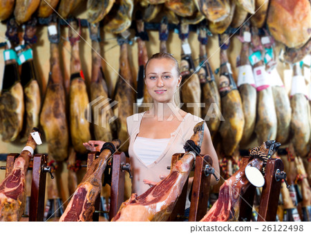 Woman picking delicious prosciutto meat 26122498