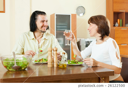 middle-aged woman and a man on tasty vegetarianhaving dinner at middle-aged woman and a man on tasty vegetarianhaving dinner at 26122500
