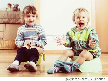 Two emotional siblings on chamber pots 26122844