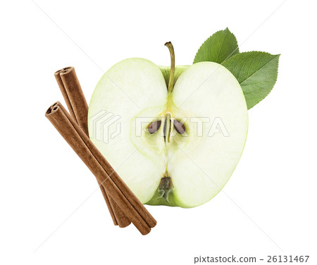 Green Apple Half Cut With Cinnamon Sticks Isolated Stock Photo