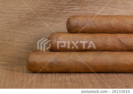 Luxury Cuban cigars  on the wooden desk 26131610
