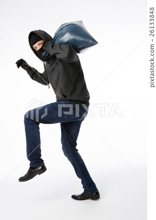 Thief in gloves with bag Thief in gloves with bag 26133848