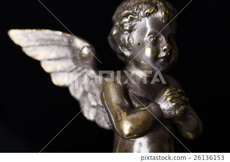 Praying brass angel side view over black 26136153