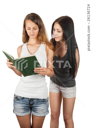 Girl spying on girlfriend  reading a book 26136724