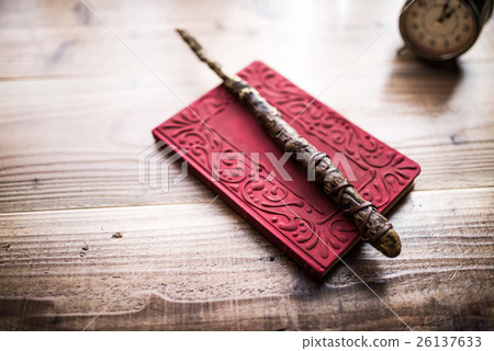 Magical wand and book 26137633