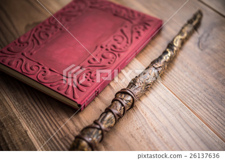 Magical wand and book 26137636