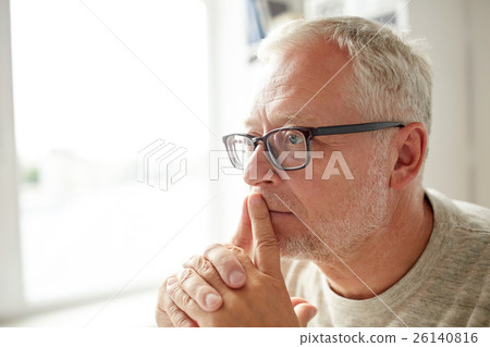 close up of senior man in glasses thinking close up of senior man in glasses thinking 26140816
