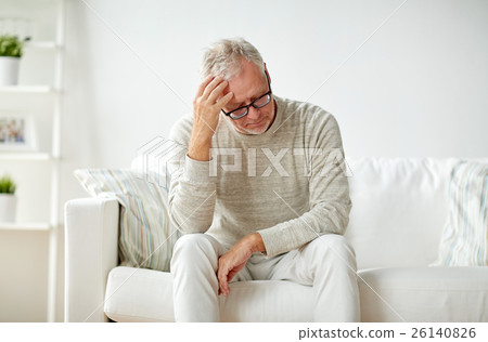 senior man suffering from headache at home senior man suffering from headache at home 26140826