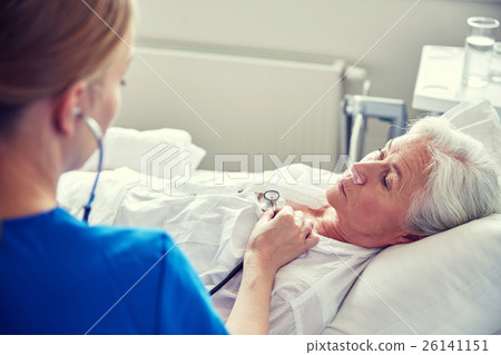 nurse with stethoscope and senior woman at clinic nurse with stethoscope and senior woman at clinic 26141151