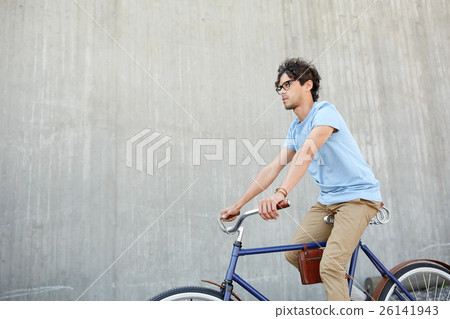 young hipster man riding fixed gear bike 26141943