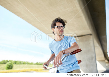 young hipster man riding fixed gear bike 26141945