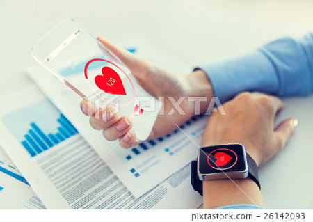 hands with heart icon on smartphone and smartwatch 26142093