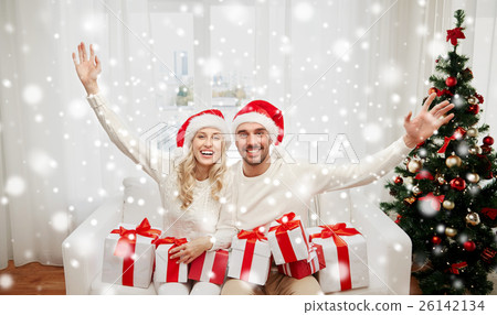 happy couple at home with christmas gift boxes 26142134