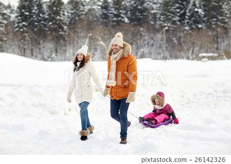 happy family with sled walking in winter forest happy family with sled walking in winter forest 26142326