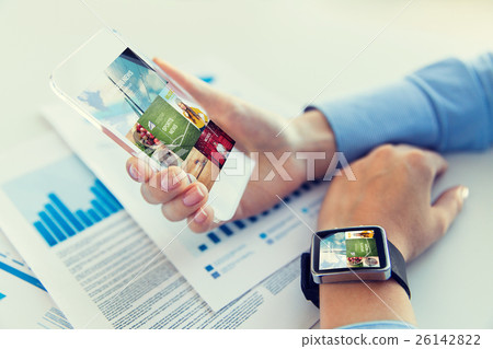 close up of hands with smart phone and watch 26142822
