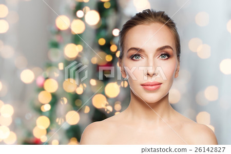 beautiful woman face over christmas lights 26142827
