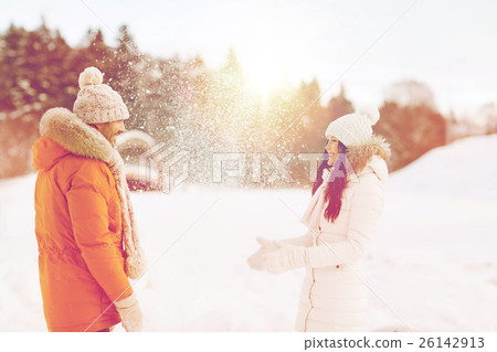 happy couple playing with snow in winter 26142913