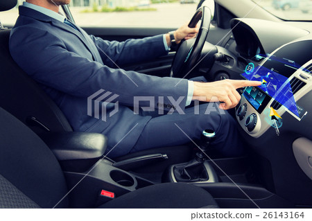 close up of man driving car with navigation 26143164