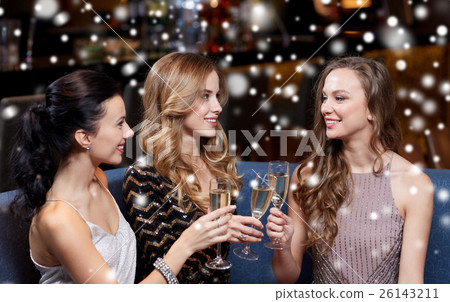 happy women with champagne glasses at night club 26143211