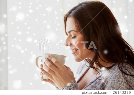 happy woman with cup of tea or coffee at home happy woman with cup of tea or coffee at home 26143259