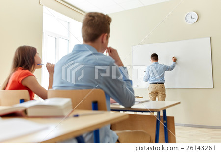students and teacher writing on school white board students and teacher writing on school white board 26143261
