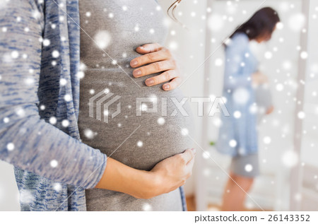 close up of pregnant woman looking to mirror close up of pregnant woman looking to mirror 26143352