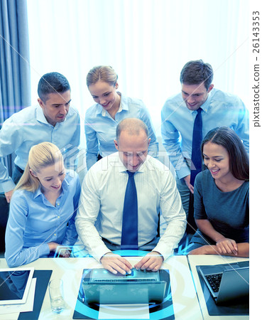 smiling business people with laptop in office smiling business people with laptop in office 26143353