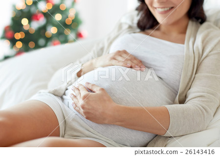 close up of pregnant woman in bed at christmas close up of pregnant woman in bed at christmas 26143416