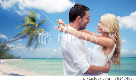 happy couple hugging over beach background 26143462