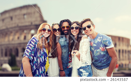 happy hippie friends with selfie stick at coliseum 26143587