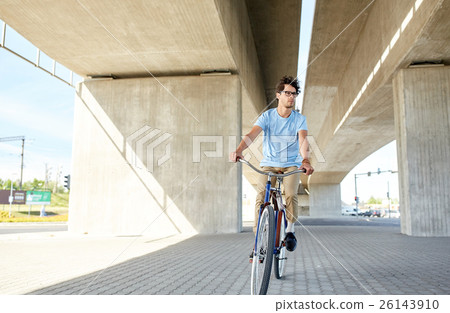 young hipster man riding fixed gear bike 26143910