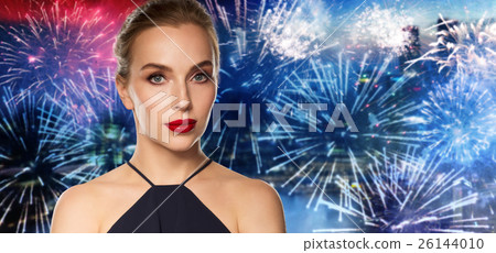 beautiful woman in black over dark background 26144010