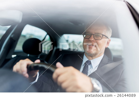 happy senior businessman driving car happy senior businessman driving car 26144089