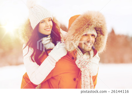 happy couple having fun over winter background happy couple having fun over winter background 26144116