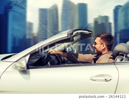 happy man driving cabriolet car outdoors 26144121