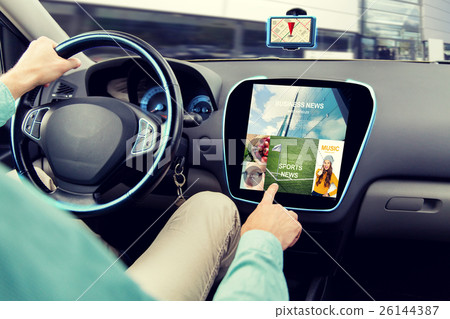close up of man driving car with news application 26144387