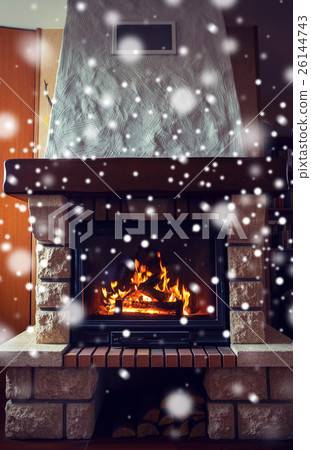 close up of burning fireplace with snow close up of burning fireplace with snow 26144743