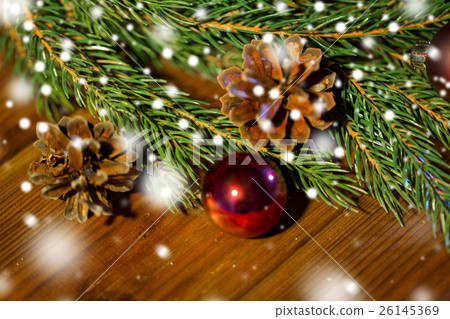 fir branch with christmas ball and pinecones fir branch with christmas ball and pinecones 26145369